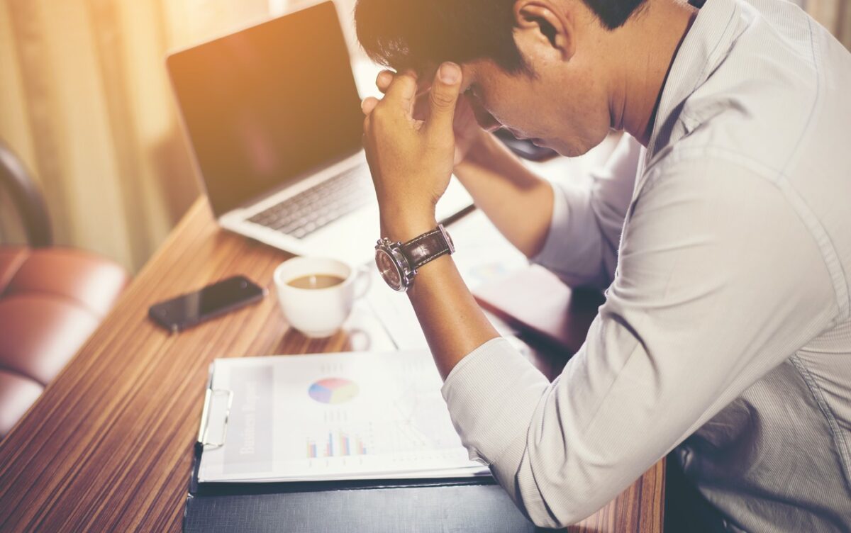 Serious businessman working to Handle Accumulated Debt