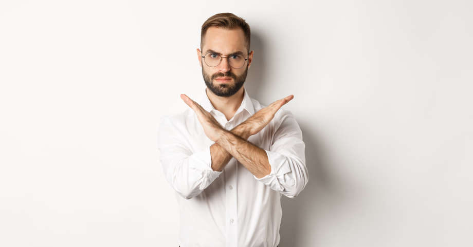 angry-businessman-frowning-showing-cross-stop-you-telling-no-prohibit-something-standing-ove. Positive Punishment