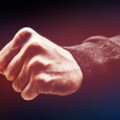 A powerful close-up of a clenched fist, conveying strength and determination.