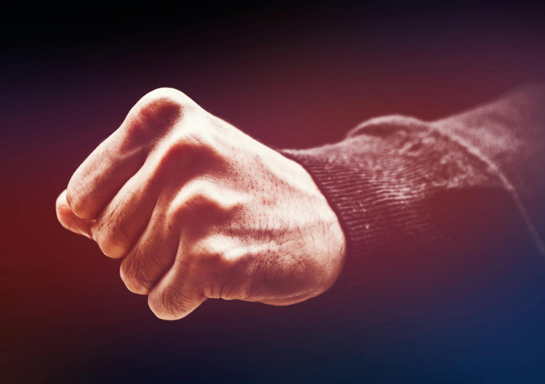 A powerful close-up of a clenched fist, conveying strength and determination.